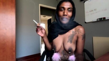 Desi in hijab smoking while wearing nipple clamps